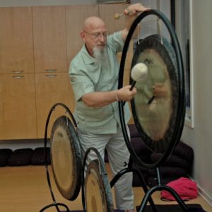 Everitt playing gong